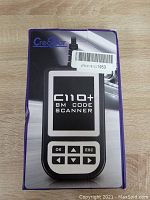 Photo of the front of the Creator C110+ BM Code Scanner box showing device image and basic branding