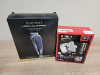 Boxed Suprent hair clipper and Foxsonic grooming kit boxes side by side