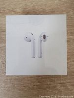 Front of sealed box showcasing the AirPods earbuds image