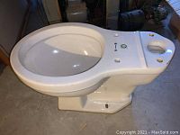 Side view of toilet bowl showing profile and base mounting holes