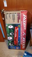 Boxed unopened Radio Flyer Classic Red Wagon showing front box panel with image of the red wagon on grass.
