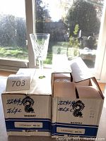 Two original boxes labeled 'Sherry Lismore 600-318' with one glass displayed next to boxes