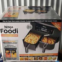 Front of retail box showing product image, branding, capacity and key features