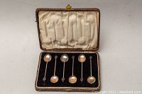 Six sterling silver small espresso/coffee spoons laid in original fitted lined box with fabric lining showing some wear and tear.