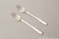 Front view of the two 830 silver beaded fruit forks showing tines and handles