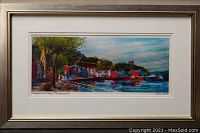 Frontal photo of framed watercolour painting showing colorful Tobermory waterfront scene including trees, houses, and water with boats, signed and titled by artist Ronnie Leckie.