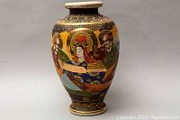 Front view of the large vintage Japanese hand-painted Moriage Satsuma style vase showing detailed traditional figures and gold embellishments.
