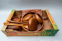 Photo of large wooden salad bowl, six smaller wooden bowls and wooden salad tongs, all in a vintage Del Monte cardboard box.