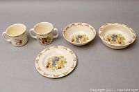 Complete set of 2 bowls, 2 mugs, and 1 plate showing overall layout and design.