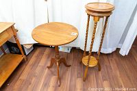 Photo showing the full view of the accent table and plant stand side by side on wooden floor.