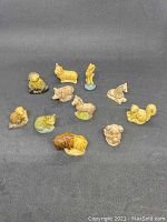 Top view photo showing all 10 Wade Whimsies animal figurines arranged on black background.