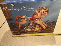 Box of the musical rocking horse showing the product image and name.