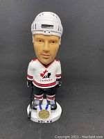 Front view of Owen Nolan bobblehead in Team Canada uniform with name and gold medal on base.