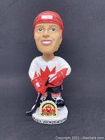 Front view of Paul Henderson bobblehead in Team Canada 1972 uniform showing facial features and base plaque.