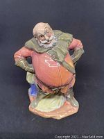 Front view of the Royal Doulton Falstaff figurine showing detailed facial expression and costume colors.