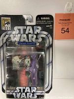 Front view of 2005 Comic Con Star Wars Holographic Princess Leia figure in original sealed packaging, showing branding and figure details.