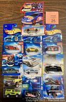 Lot of 12 brand new sealed Hot Wheels cars including ProRacing 1997 model, various other classic and contemporary models each sealed on original blue Hot Wheels packaging cards.