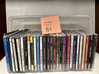 Image of the entire lot of 22 CDs showing front spines in jewel cases.