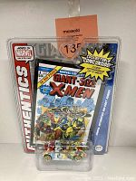 Front view of packaged Marvel X-Men die-cast car with visible miniature comic book cover