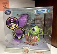 Front view of boxed Mike and Art action figures from Monsters University, showing colorful figures and packaging.