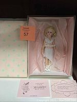 Doll in original box with certificate and protective tissue paper