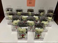 Fourteen boxed Ninjas Zombies Bobble Budds Original Collection Patient Zero bobblehead figures arranged on a white surface.