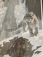 Close-up detail of the snow leopard artwork showing its fur and snowy environment.