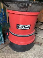 Red Flowtron Leaf Eater leaf mulcher showing main body and lower collection bag.