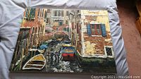 Top view of the Venice canal print on canvas showing boats, water reflections and buildings.