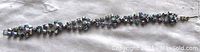 Full view of the blue rhinestone link bracelet laid out flat showing the length and linked design.