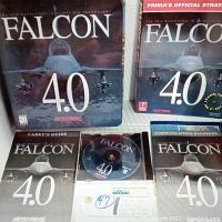Photo showing Falcon 4.0 large binder case, game CD, Cadet's Guide, Communications Handbook, and PRIMA's Official Strategy Guide.