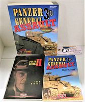 Front covers of three PC video game manuals: Panzer General 3D Assault Official Strategy Guide, Panzer General II User Manual, and Panzer General 3D Assault User Manual with Hot Keys reference card
