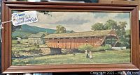 Framed, wide-view of Eric Sloan artwork showing the red covered bridge and surrounding landscape with two children in foreground.