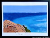 Frontal view of framed painting titled “Cote d'Azur” depicting Mediterranean sea and cliff rooftops
