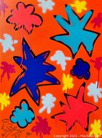 Front view of vibrant orange street art painting featuring large colorful star and flower motifs and artist signature.
