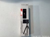 Photo of front of the box with the product name GorillaPod 325 and image of the tripod with a camera mounted.