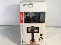 Front view of Joby GorillaPod GripTight Kit packaging showing tripod, remote, and mount inside.