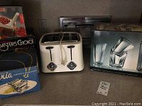 Side view showing Toastmaster toaster and boxed Anchor glassware