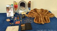 Photo showing the full collection of items including mink stoll, jewelry laid out, magnifying mirror, pantyhose packages, powder compact, and soaps.