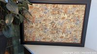 Full view of the rectangular framed corkboard with a vintage world map on cork surface, showing its size and frame.
