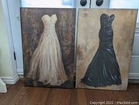 Pair of prints side by side showing both ball gowns on stretched canvas frames against a wall and floor