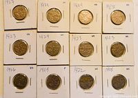 Fifteen Canadian nickels mounted individually on white coin holders with date and condition markings visible. Varied dates from early 20th century, focus on 1920s-1930s.