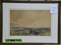 Framed watercolour landscape painting with white mat and gold decorative frame, artist signature on bottom right.