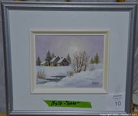The full framed painting showing the Quebec winter scene and the dimensions label.