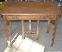 Front view of table with drawer and apron detailing