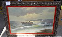 Full view of framed oil painting showing seascape and ornate frame