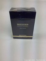 Front view of the black Boucheron Pour Homme Eau de Toilette box with gold text and border, showing the brand and product name clearly.
