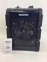 Front view of black Mastercraft space heater showing front mesh grill and fan behind, with control knobs on top and Mastercraft logo on front.