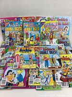 A collection laid out of multiple vintage Archie comic books showing front covers featuring Archie, Jughead, Betty, and Veronica characters.
