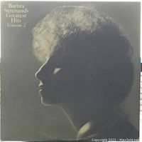 Front cover of Barbra Streisand's Greatest Hits Volume 2 showing a black-and-white profile image of the singer with title text.